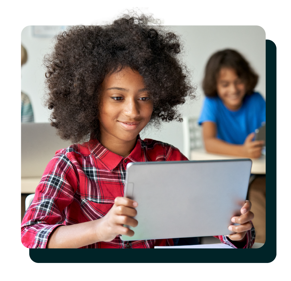 Student smiling with tablet