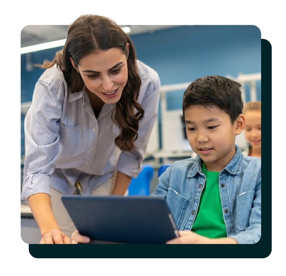 Teacher assisting a middle school student