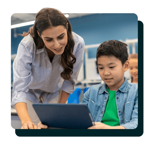 Teacher assisting a middle school student Teacher assisting a middle school student